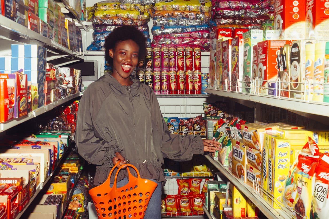 A shopper finding what she needs among packed shelves at Bobby's Discount Store in Orange, New Jersey